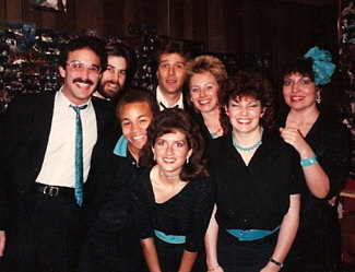 Here's Eight To The Bar, posing before a live gig, circa 1985; probably at Fellini's, a great little Italian restaurant and club on Melrose in L.A. which has, sadly, been gone for many years. We used to cram all eight of us onto their tiny little stage and sing, with our sole pay being a meal provided by Fellini's (not a bad deal when you're a starving young singer!)... Personnel, L to R: Gary Rosen, Randy Crenshaw, Stewart Wilson-Turner, Bill New, Robin Ehlers, Barbara Bentree, Jan Roper, Pam Austin. 